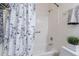 Bright bathroom with a shower over tub and a decorative curtain, and a white sink at 7606 E Globemallow Ln, Gold Canyon, AZ 85118