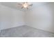 Bedroom features a ceiling fan and carpeted flooring at 7606 E Globemallow Ln, Gold Canyon, AZ 85118