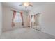 Bedroom with sliding closet, large window and ceiling fan at 7606 E Globemallow Ln, Gold Canyon, AZ 85118