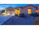 Exterior features a well maintained front yard and a two-car garage at 7606 E Globemallow Ln, Gold Canyon, AZ 85118