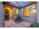 Charming home exterior featuring decorative screen door and well maintained desert landscaping at 7606 E Globemallow Ln, Gold Canyon, AZ 85118
