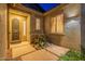 Cozy front entrance features desert landscaping and security door at 7606 E Globemallow Ln, Gold Canyon, AZ 85118