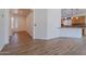 Open-concept living room with wood floors seamlessly connects to the dining and kitchen areas at 7606 E Globemallow Ln, Gold Canyon, AZ 85118