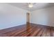 Bright living room boasts hardwood floors, neutral paint, and ceiling fan at 7606 E Globemallow Ln, Gold Canyon, AZ 85118