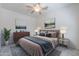 Main bedroom features a ceiling fan, artwork, dresser, and nightstands at 7606 E Globemallow Ln, Gold Canyon, AZ 85118