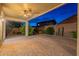 Large covered brick patio with ceiling fan offers ample space for outdoor entertaining with a beautiful night sky at 7606 E Globemallow Ln, Gold Canyon, AZ 85118