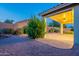 Spacious covered patio with brick flooring and desert landscaping at 7606 E Globemallow Ln, Gold Canyon, AZ 85118