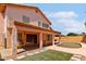 Backyard oasis with covered patio, pool, and artificial turf area for entertaining at 7767 W Sierra Vista Dr, Glendale, AZ 85303