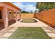Backyard features a private pool, patio, and artificial turf, perfect for outdoor living at 7767 W Sierra Vista Dr, Glendale, AZ 85303