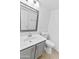 This bathroom features modern fixtures, a sink with a vanity, a toilet, and ample lighting at 7767 W Sierra Vista Dr, Glendale, AZ 85303
