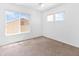 This bright bedroom features neutral carpet and windows providing natural light at 7767 W Sierra Vista Dr, Glendale, AZ 85303