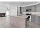Open concept kitchen featuring gray cabinetry, an island, and stainless steel appliances at 7767 W Sierra Vista Dr, Glendale, AZ 85303