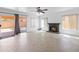 Open concept living room with fireplace and access to the back yard at 7767 W Sierra Vista Dr, Glendale, AZ 85303