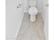 Close-up of a well-maintained toilet with tiled flooring in a neat, compact space at 7767 W Sierra Vista Dr, Glendale, AZ 85303