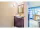 Cozy bathroom with single vanity, a unique countertop, and ample storage space at 8111 W Wacker Rd # 62, Peoria, AZ 85381