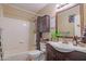 Full bathroom featuring a shower-tub combo and vanity with dark wood cabinetry at 8111 W Wacker Rd # 62, Peoria, AZ 85381