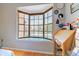 Bright bedroom featuring a charming bay window and a vintage writing desk at 8111 W Wacker Rd # 62, Peoria, AZ 85381