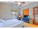 Bright bedroom featuring a ceiling fan, a bay window, and unique decor at 8111 W Wacker Rd # 62, Peoria, AZ 85381