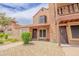 Charming townhome featuring a brick chimney, cozy balcony, and well-maintained landscaping at 8111 W Wacker Rd # 62, Peoria, AZ 85381