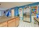 Bright kitchen features an island with granite countertops and a stainless steel refrigerator at 8111 W Wacker Rd # 62, Peoria, AZ 85381