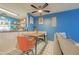Bright dining area leading to a kitchen and features colorful accents and comfortable seating at 8111 W Wacker Rd # 62, Peoria, AZ 85381