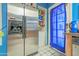 Kitchen features a stainless steel refrigerator and easy access to the exterior at 8111 W Wacker Rd # 62, Peoria, AZ 85381