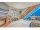 Cozy living room featuring a brick fireplace, open staircase, and bright natural light at 8111 W Wacker Rd # 62, Peoria, AZ 85381