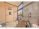 Enclosed patio area with screened windows and door to the exterior, storage box, and storage items at 8111 W Wacker Rd # 62, Peoria, AZ 85381