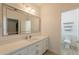 Bright bathroom featuring vanity with white countertop and updated fixtures at 8502 E Santa Catalina Dr, Scottsdale, AZ 85255