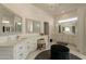 Bright bathroom with double vanity, walk-in closet, and makeup vanity at 8502 E Santa Catalina Dr, Scottsdale, AZ 85255