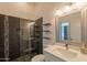 Stylish bathroom with glass-enclosed shower, floating shelves, and designer accents at 8502 E Santa Catalina Dr, Scottsdale, AZ 85255