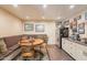 Cozy breakfast nook with banquette seating and stainless steel refrigerator at 8502 E Santa Catalina Dr, Scottsdale, AZ 85255