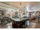 Expansive game room with pool table, workout equipment, and stylish decor at 8502 E Santa Catalina Dr, Scottsdale, AZ 85255