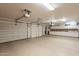 Clean, spacious garage with a workshop area featuring plenty of cabinets for storage and organization at 8502 E Santa Catalina Dr, Scottsdale, AZ 85255