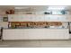 Well-organized garage storage with white cabinets, a workbench, and pegboard wall, maximizing space and functionality at 8502 E Santa Catalina Dr, Scottsdale, AZ 85255
