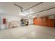 Large garage with ample storage, built-in cabinets, and epoxy floors, providing a functional and organized space at 8502 E Santa Catalina Dr, Scottsdale, AZ 85255