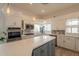 Modern kitchen with white cabinets, quartz countertops, stainless steel appliances, and a stylish island at 8502 E Santa Catalina Dr, Scottsdale, AZ 85255
