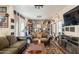 Comfortable living room with plush sofas, dark accent walls, and stylish decor at 8502 E Santa Catalina Dr, Scottsdale, AZ 85255