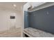 Charming mudroom with a built-in bench and storage, perfect for organization at 8502 E Santa Catalina Dr, Scottsdale, AZ 85255