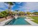Private backyard oasis with sparkling pool, mature landscaping, and outdoor entertaining area at 8502 E Santa Catalina Dr, Scottsdale, AZ 85255