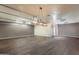 Large recreation room features wooden floors, ample lighting, neutral walls, and is ready for personalization and entertainment at 8502 E Santa Catalina Dr, Scottsdale, AZ 85255