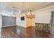 Spacious room with wooden floors, decorative lighting, with a wooden bar for relaxation and entertaining at 8502 E Santa Catalina Dr, Scottsdale, AZ 85255