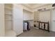 Organized walk-in closet features custom shelving, hanging rods, and ample storage space at 8502 E Santa Catalina Dr, Scottsdale, AZ 85255