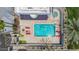 Aerial view of backyard pool, jacuzzi, and lounging area with mature landscaping and privacy fence at 902 W Glendale Ave # 102, Phoenix, AZ 85021