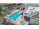 Birds eye view of pool, jacuzzi, and outdoor lounge area with a modern exterior at 902 W Glendale Ave # 102, Phoenix, AZ 85021