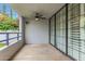 Outdoor balcony with a ceiling fan and flowering vegetation, offering a relaxing space at 902 W Glendale Ave # 102, Phoenix, AZ 85021