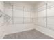 Organized walk-in closet with white shelving units for optimal storage at 902 W Glendale Ave # 102, Phoenix, AZ 85021