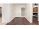 Interior entryway featuring hardwood floors, white walls, and a glass block window in the foyer at 902 W Glendale Ave # 102, Phoenix, AZ 85021