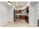 Bright kitchen features stainless steel appliances and tile flooring at 902 W Glendale Ave # 102, Phoenix, AZ 85021