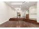 Open living room with hardwood floors, fireplace, built-in cabinets, and recessed lighting at 902 W Glendale Ave # 102, Phoenix, AZ 85021